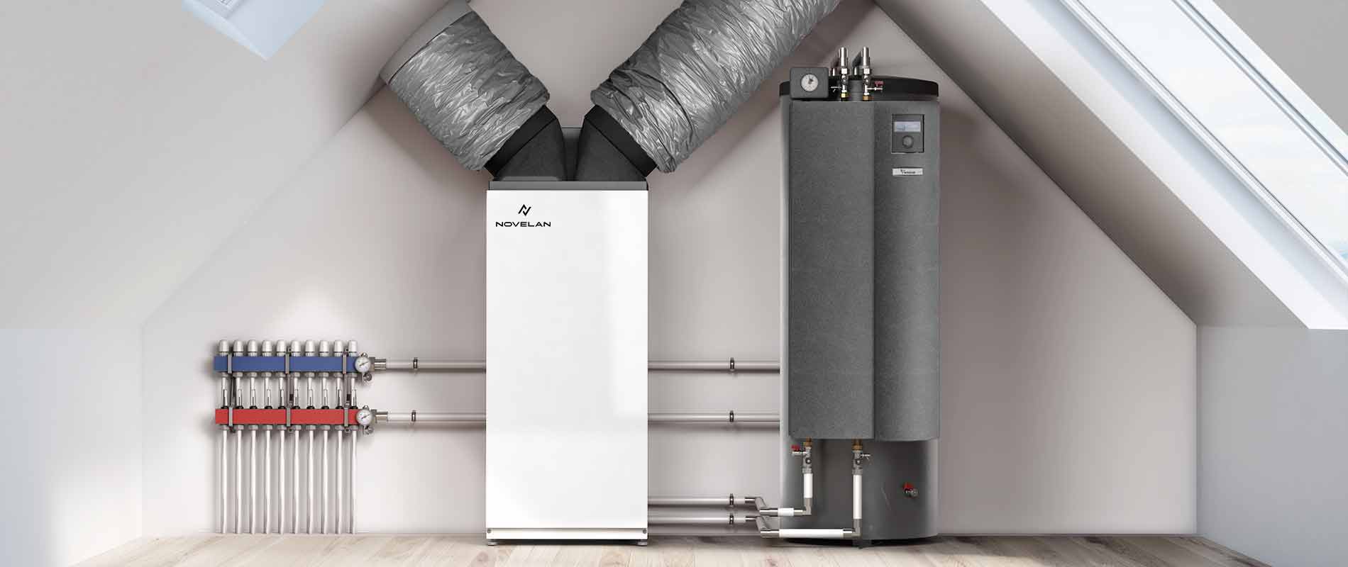 The heat pump Polaris can be seen installed under a sloping roof, with a Compact station on its right and pipes extending into the wall on the left.